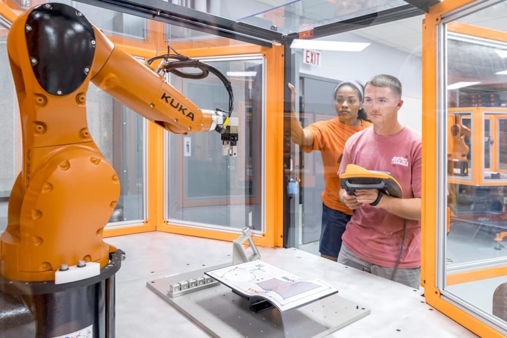 Students control robotic arm