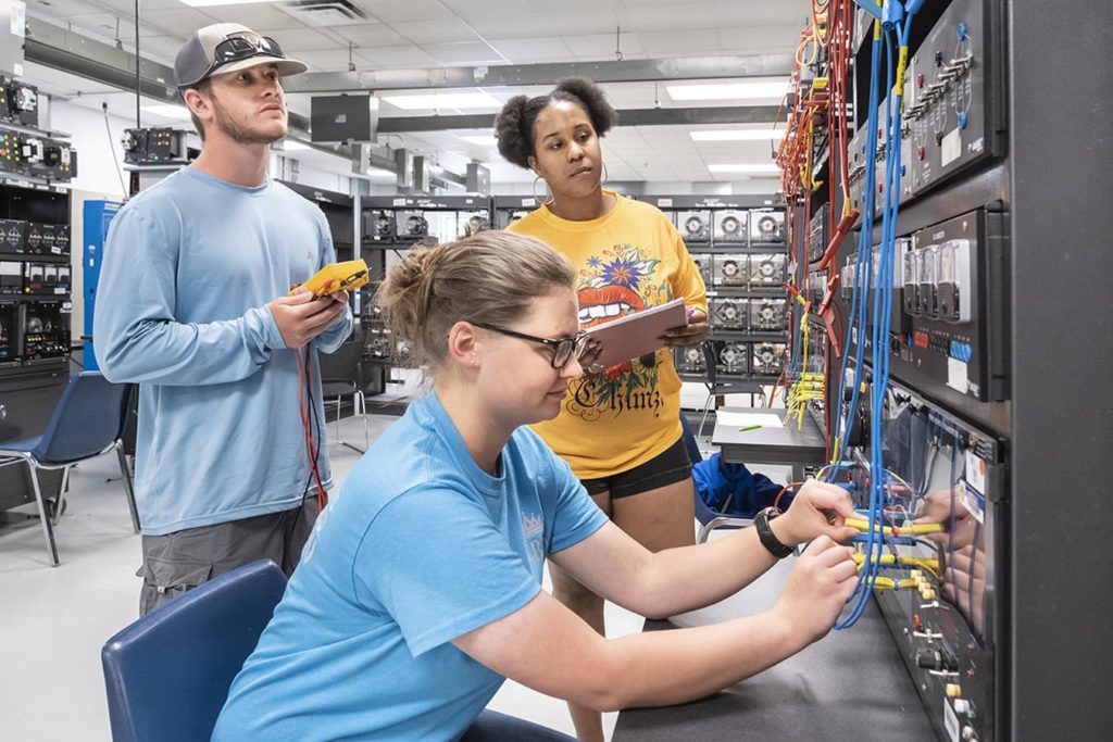 Students working on industrial electronics