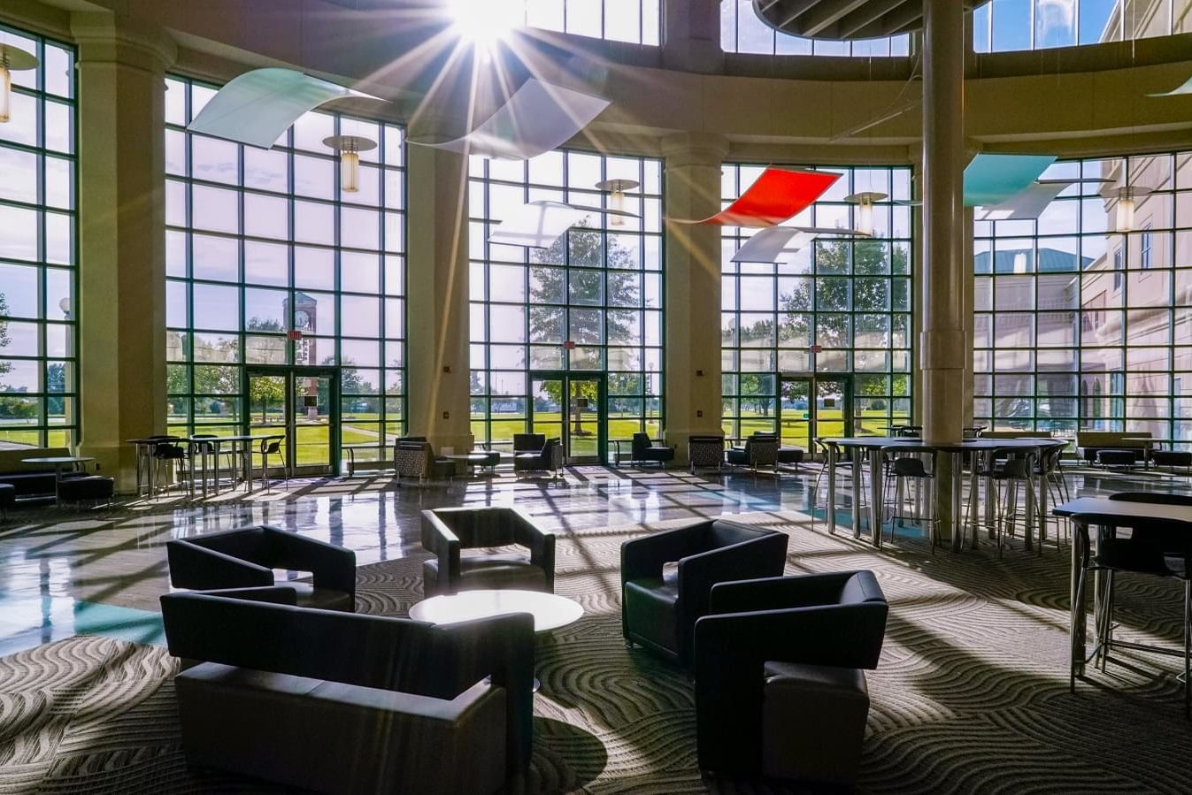 Shelton State Atrium with bright windows and dark chairs