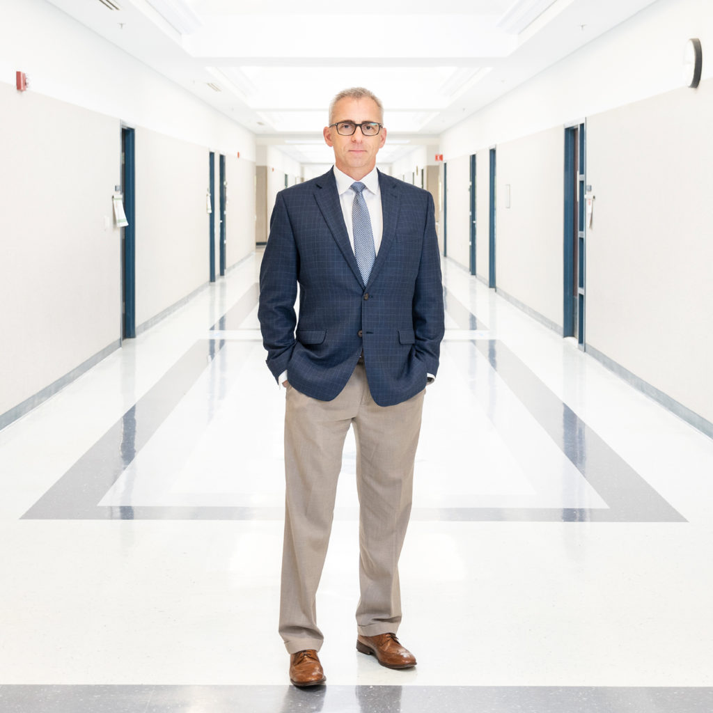 Brad Newman, President in a hallway at Shelton State